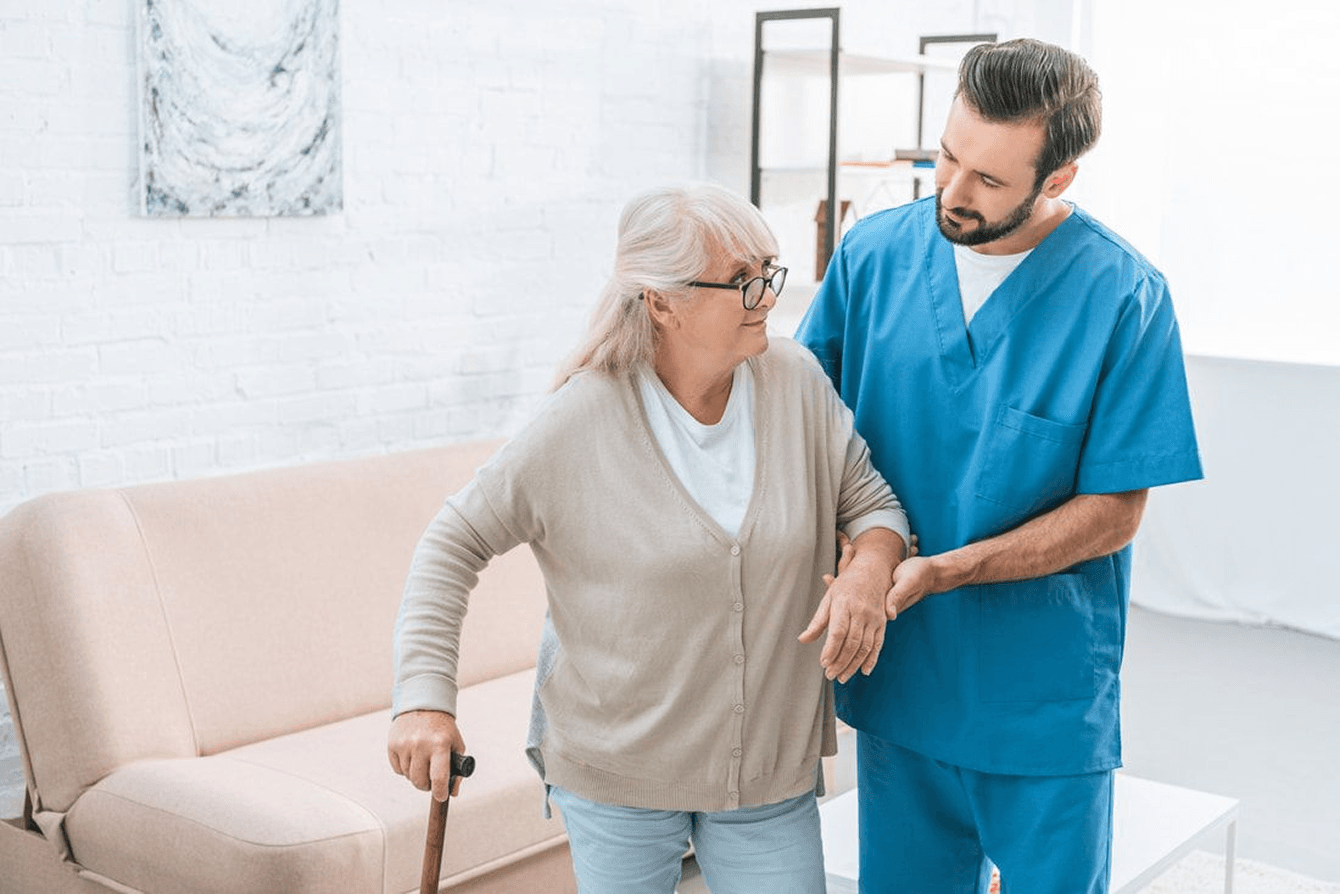 Caregiver and client with walker in a supportive setting