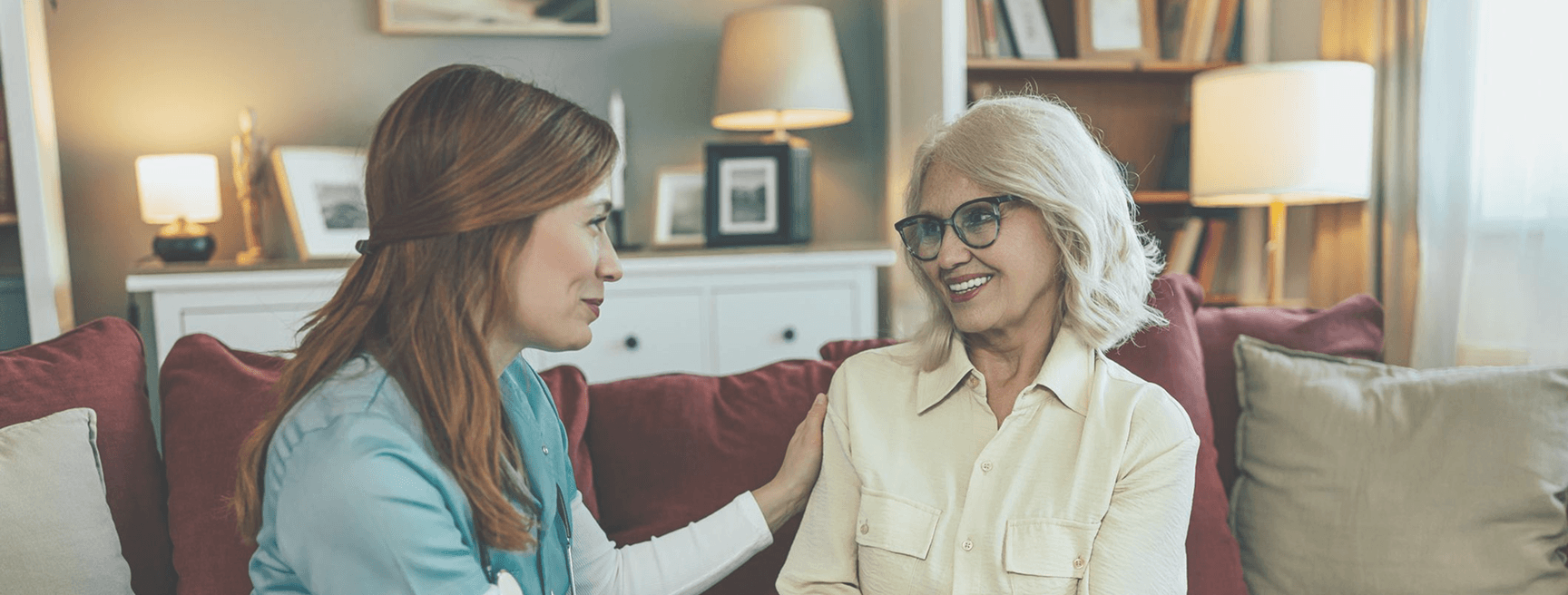 Caregiver and client in a warm home setting