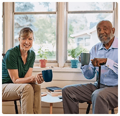Caregiver and client engaged in an activity, conveying connection and support
