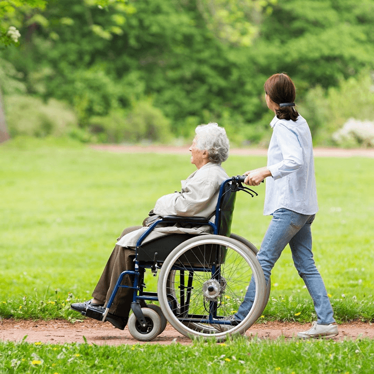 Caregiver and client in a warm, supportive home setting