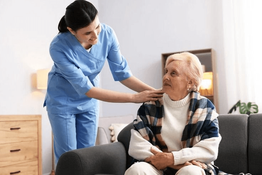 Caregiver and clients in a relaxed, social interaction